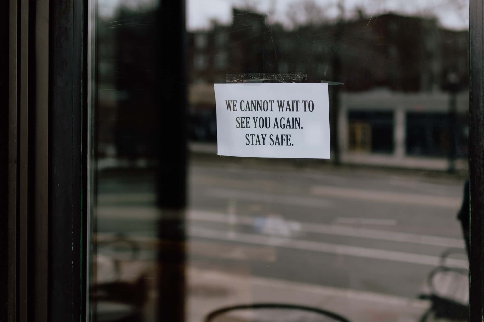 Sign in store window that reads